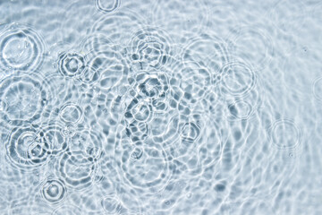 Circle ripples on water surface. Ripples on the water background. Pure clear water