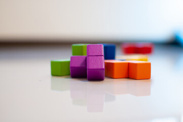 Obraz premium Child's wooden blocks on the floor. 