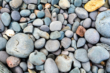 Fototapeta na wymiar Pebbles background from overhead to show stone surface