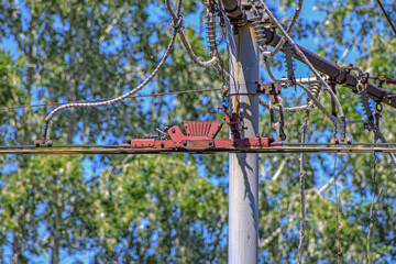 Fragment of the trolley line of the city trolleybus on a summer day