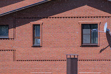 Fragment of the facade of a residential building on a summer day