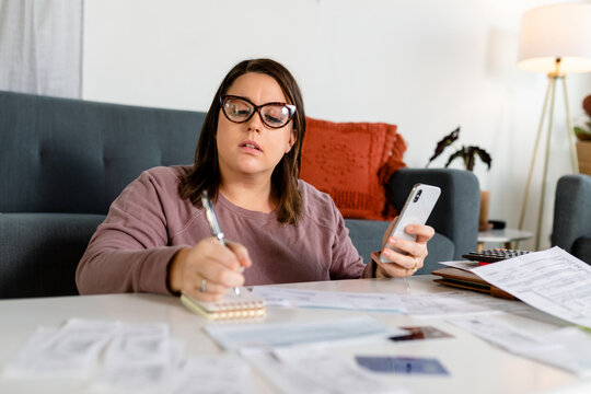 Woman Works on Preparing Her Annual Taxes From the Comfort of Her Home