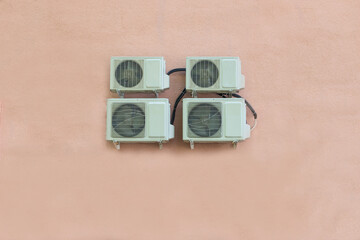 Fans for ventilation of the store or office on the pink wall. Office fans close-up. Air conditioning and ventilation systems with a copy of the space.