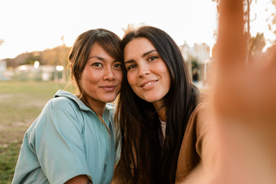 Happy Lesbian Couple Takes Selfie While on a Date at the Park