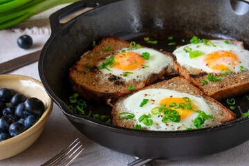 rustic breakfast with bread, eggs and berries