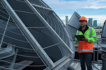 worker on site. worker checking cooling tower. worker walk on Cooling tower plant with checking job.