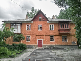 Old orange two-storey residential building.