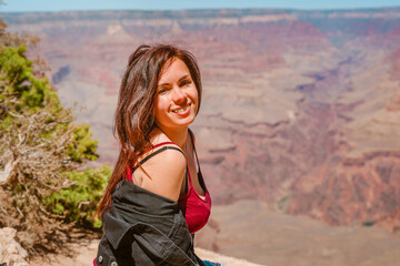 Female happy tourist at Grand Canyon, Arizona