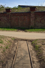 Fototapeta na wymiar 18 Inch narrow gauge military railway built in 1888 to supply army depot at Hospital Fields, York. Located at side of river Ouse the railway was horse worked and supplied by the Powder Boat.