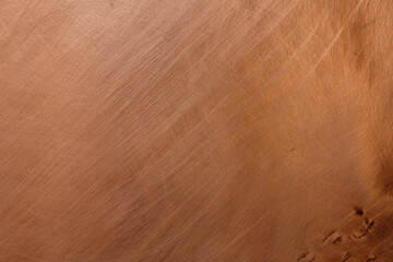 Copper background. Chaotic scratches. Copy space. 