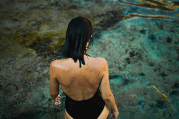 Back View Of Young Woman By The Sea
