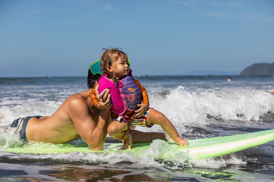 Family surfing with son in Costa Rica 