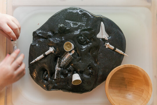 outer space themed sensory play with slime