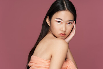 Fototapeta premium woman asian appearance Cosmetics glamor model pink background