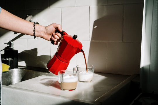 Man making coffe in kitchen