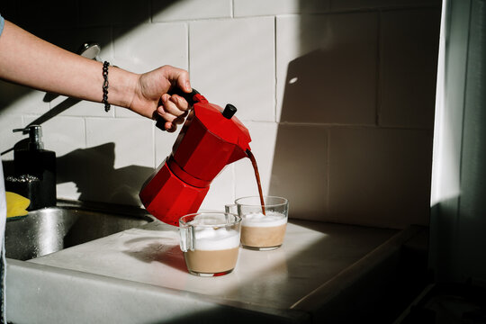 Man making coffe in kitchen