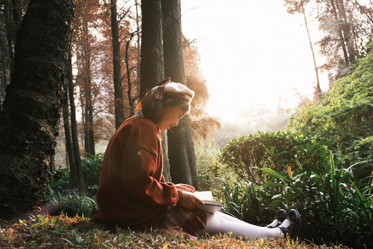 Young Asian woman in a botanical park