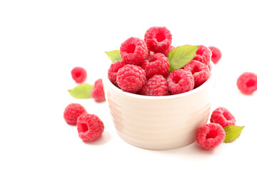 raspberry in bowl isolated on white background