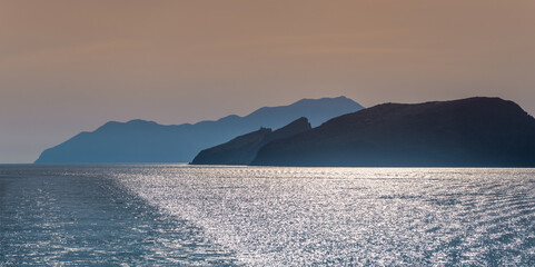 Cyclades islands silhouettes in Aegean sea