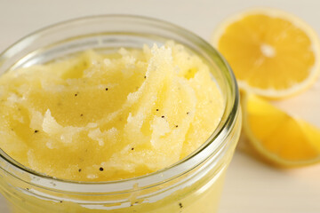 Body scrub in glass jar on table, closeup