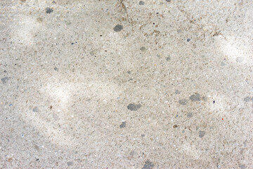 The concrete with many pebbles.
