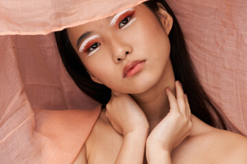romantic woman in hat asian appearance bright makeup and clean skin model