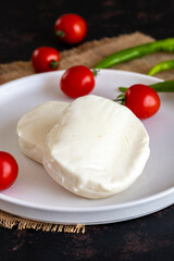 Kunefe cheese on a dark background.