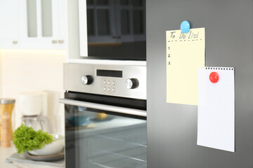 Blank To do list and paper on fridge in kitchen. Space for text
