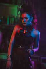 Fototapeta na wymiar girl in cyberpunk style with a gas mask and steampunk costume