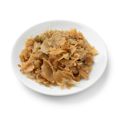 Traditional Chinese fermented cabbage on a ceramic plate close up isolated on white background 