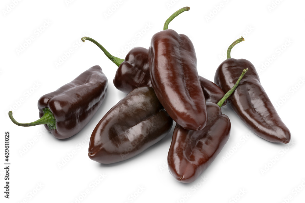 Wall mural heap of whole fresh chocolate mini pointed bell peppers close up isolated on white background backgr