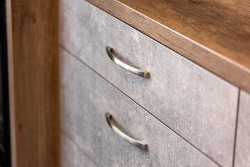Metal handles on drawer, detail close up