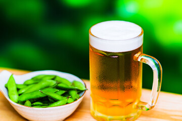 beer mug and edamame beans in summer