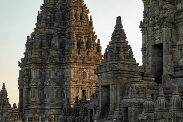 Foto op Canvas Close-up of the Prambanan ancient Hindu temples, empty at sunset, remain silent, after the departure of tourists, Central Java, Indonesia © Alvaro