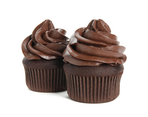 Delicious chocolate cupcakes with cream on white background