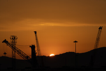 sunset with cranes