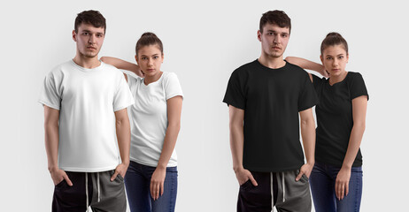 Obraz premium Stylish white, black T-shirt template on a guy and a girl posing, isolated on the background.