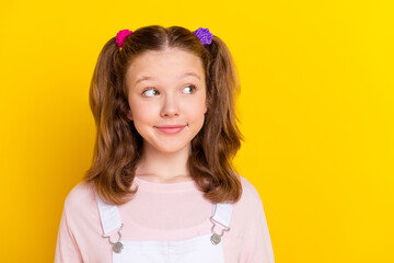 Photo portrait schoolgirl in casual clothes looking copyspace isolated bright yellow color background
