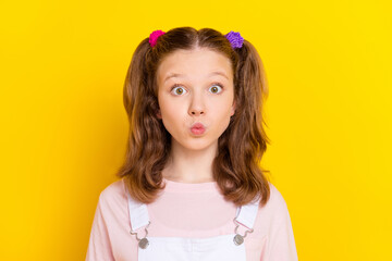 Photo portrait schoolgirl with tails sending air kiss wearing casual clothes isolated bright yellow color background