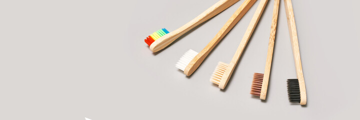 Set of ecology toothbrush on grey background. Different color. Diversity concept. Sustainable mouth product. Zero waste lifestyle. Organic accessory group. Dental health at home. Biodegradable recycle