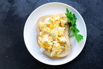 scramble fried egg scrambled breakfast dish on the table healthy food meal snack copy space food background rustic. top view
