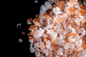 Closeup of Himalayan salt with pinkish , white and transparent crystals used for preparation of...
