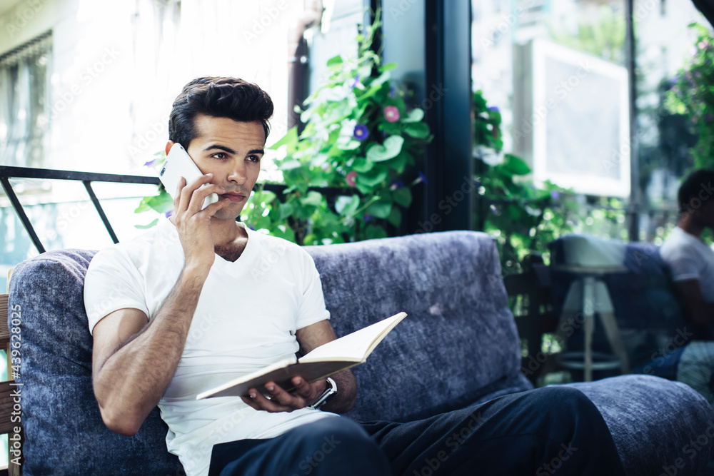 Poster intelligent male student with education notepad using 4g wireless for calling and discussing knowled