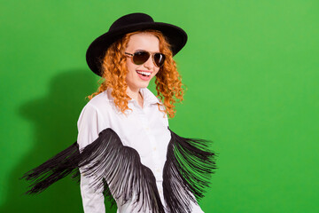 Portrait of attractive cheerful fashionable girl having fun air blowing fringe isolated over bright...