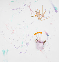 Fabric Background With Drips Of Paint; Photo With Metallic Bucket And Brushes.