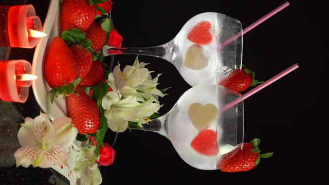 Romantic composition with cocktail glasses on Valentines Day, 4k vertical video