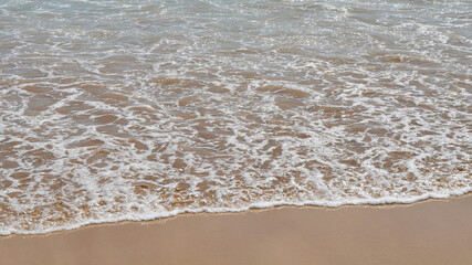 summer sea waves on the beach with blue sky