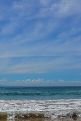 summer sea waves on the beach with blue sky