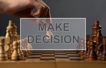 Make Decision text on photo with pawn making first step.