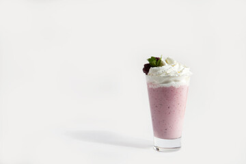 milkshakes in a glass with whipped cream and mint. Smoothie. on white background